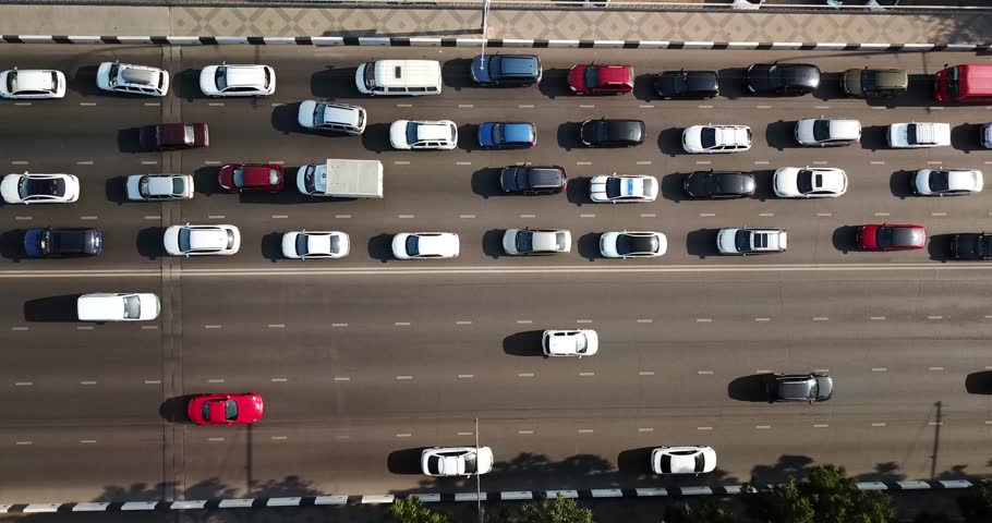 Aerial Drone Flight Top Down View Of Freeway Busy City Rush Hour Heavy Traffic Jam Highway  Aerial View Of The Vehicular Intersection  Traffic At Peak Hour With Cars On The Road Over The Bridge