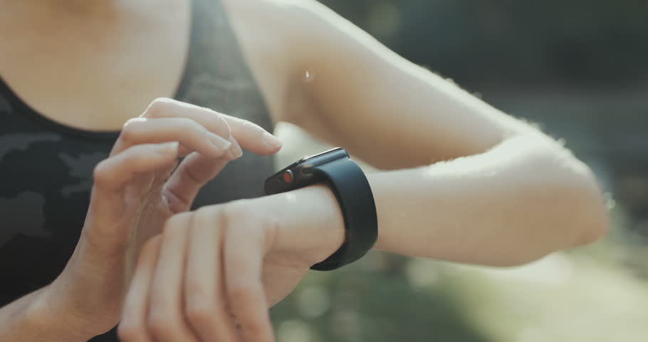 Young Woman Trying New Smart Watch Smart Watch Woman Using Smart Watch And Smart Phone Closeup