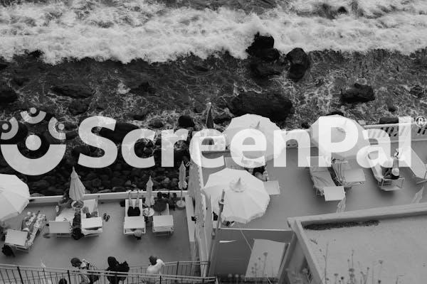 Black And White Seaside Terrace With Umbrellas