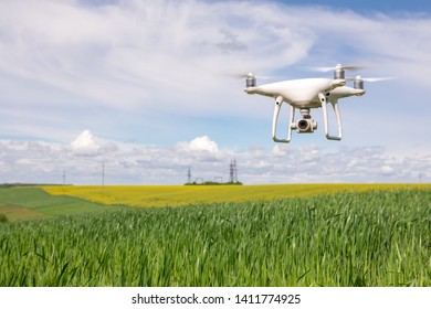 Close Up On White Drone Camera Drone Quadcopter In Flight