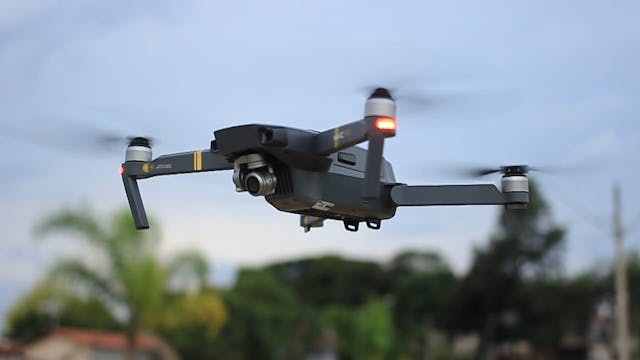 Full Shot And Close Up Footage Of A Flying Drone Machine