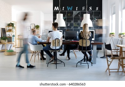 People Working In Modern Creative Work Environment