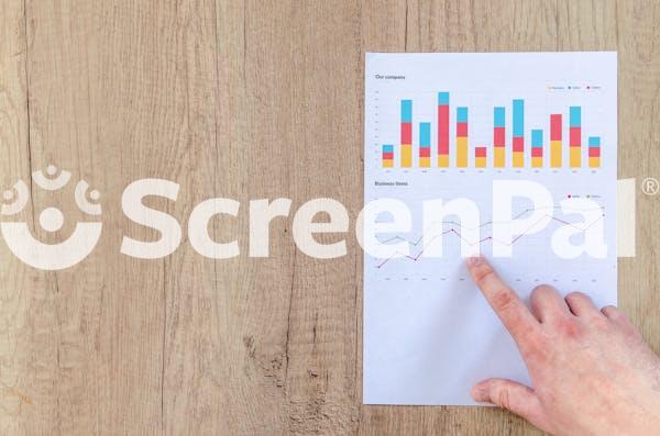 Person Pointing Paper Line Graph