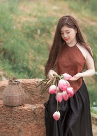Woman Holding Pink Tulips