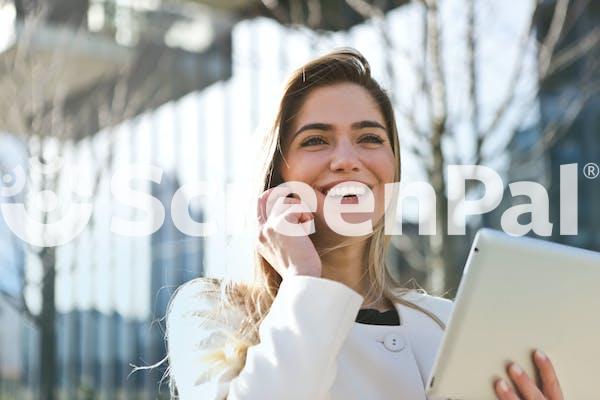 Woman In White Blazer Holding Tablet Computer